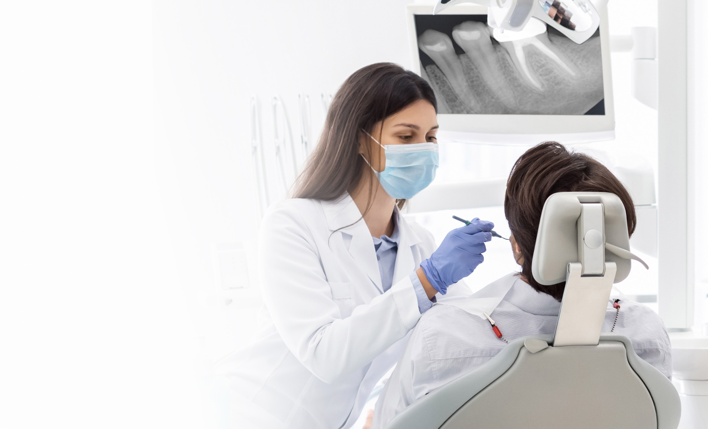 Dentists checking patient with a Dental x-ray